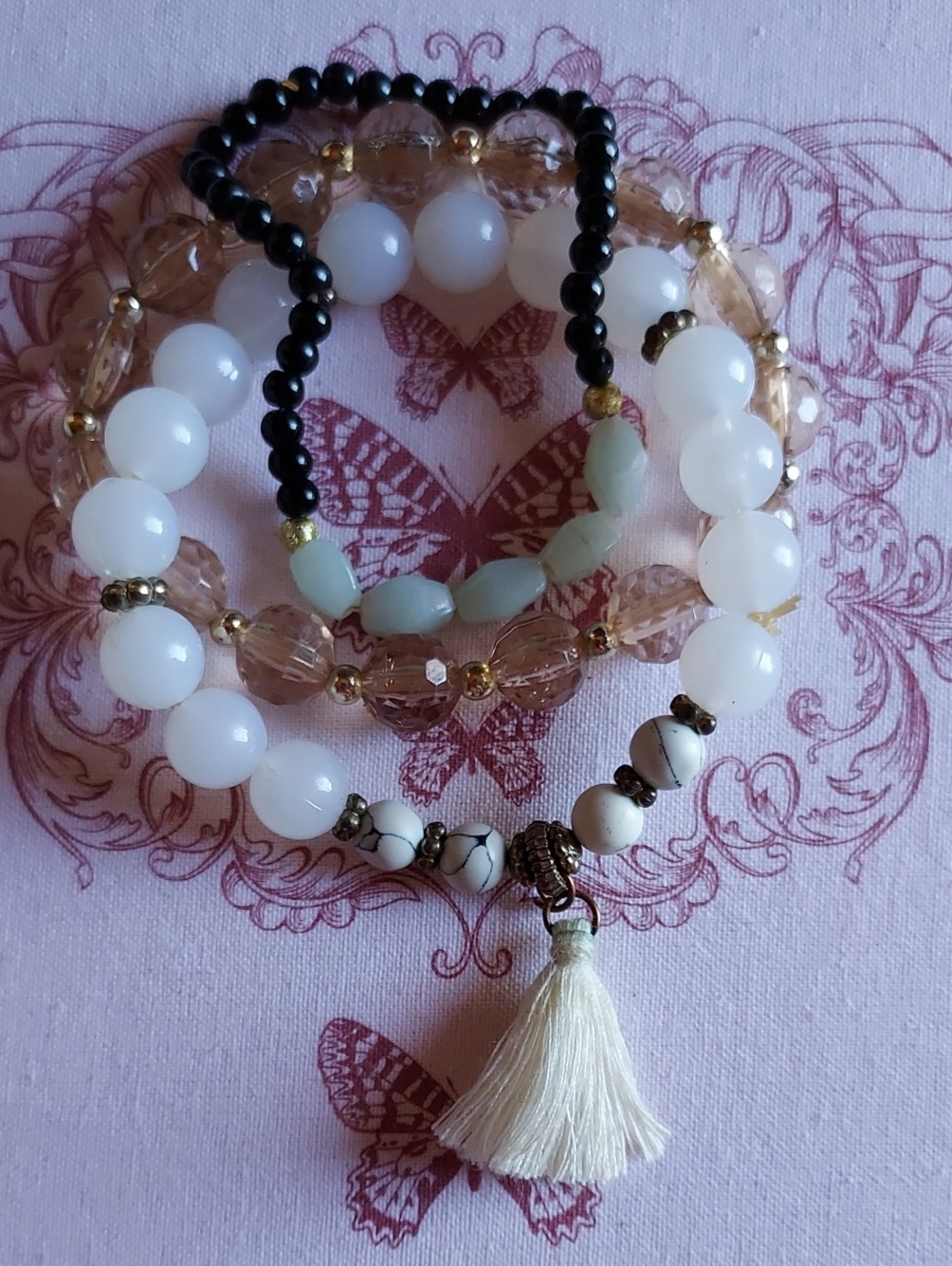 Handmade White Beaded Bracelet Stack with Cream Tassel